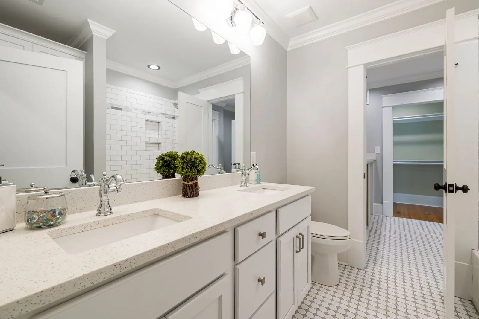 Bright bathroom with a double vanity and a tiled floor