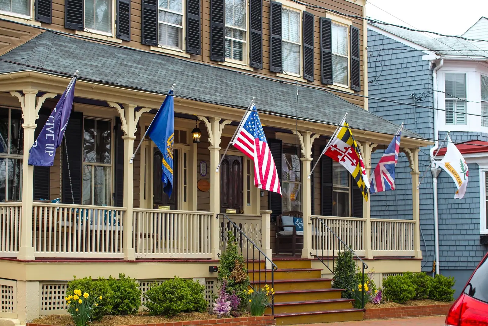 Historic house with flags on its porch in Annapolis, Maryland