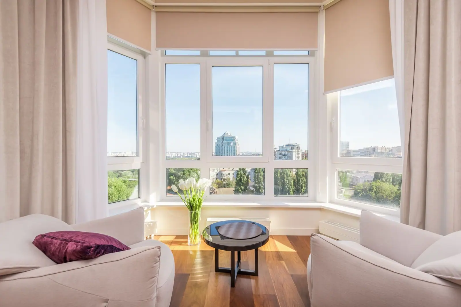 Sunny sitting room with a wall of large windows